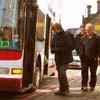 People boarding bus.