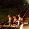 Children cross railway line.